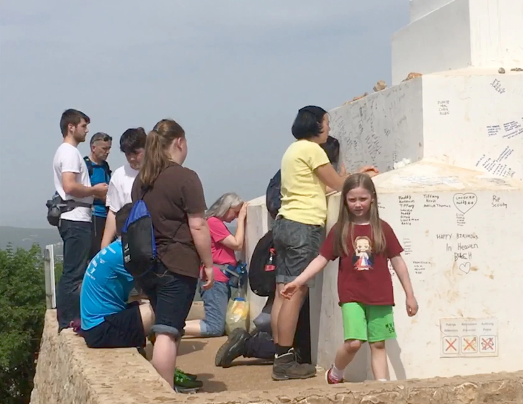 This is another photo of the Richard L George family praying before the Cross on Cross Mountain in Medjugorje photograph